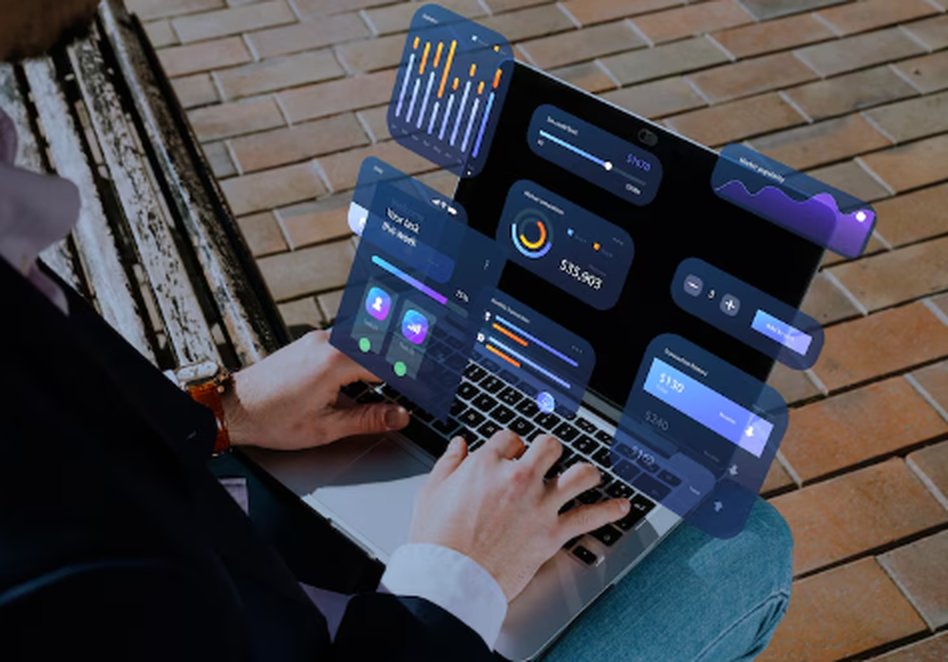 Person using a laptop with financial dashboards and graphs overlaid, representing digital tools to automate your finances efficiently in 2025.