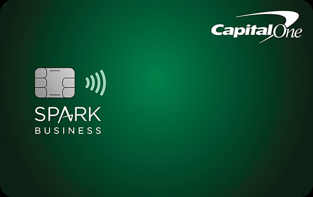 Green Spark Business credit card from Capital One displayed on a gradient green background. The card features a contactless payment symbol, an embedded chip on the left side, the ‘Spark Business’ branding, and the Capital One logo in the upper-right corner. The minimalist design highlights a professional business credit card focused on simple cash-back rewards and everyday spending for small businesses.